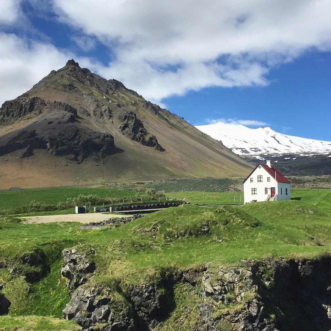 Arnarstapi village beneath Stapafell mountain and Snæfellsjökull glacier on the Snæfellsnes peninsula