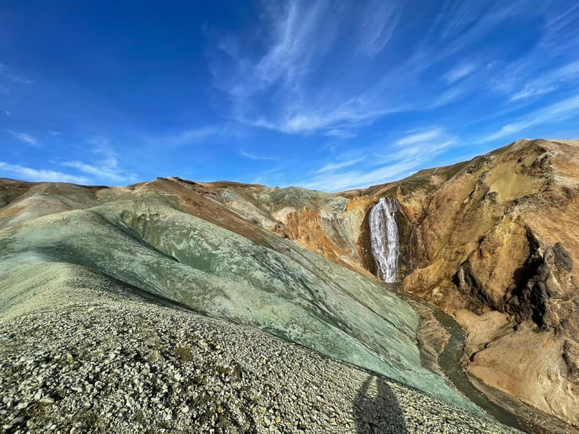 Colourful rhyolite mountains and a waterfall near Landmannalaugar in the Icelandic highlands